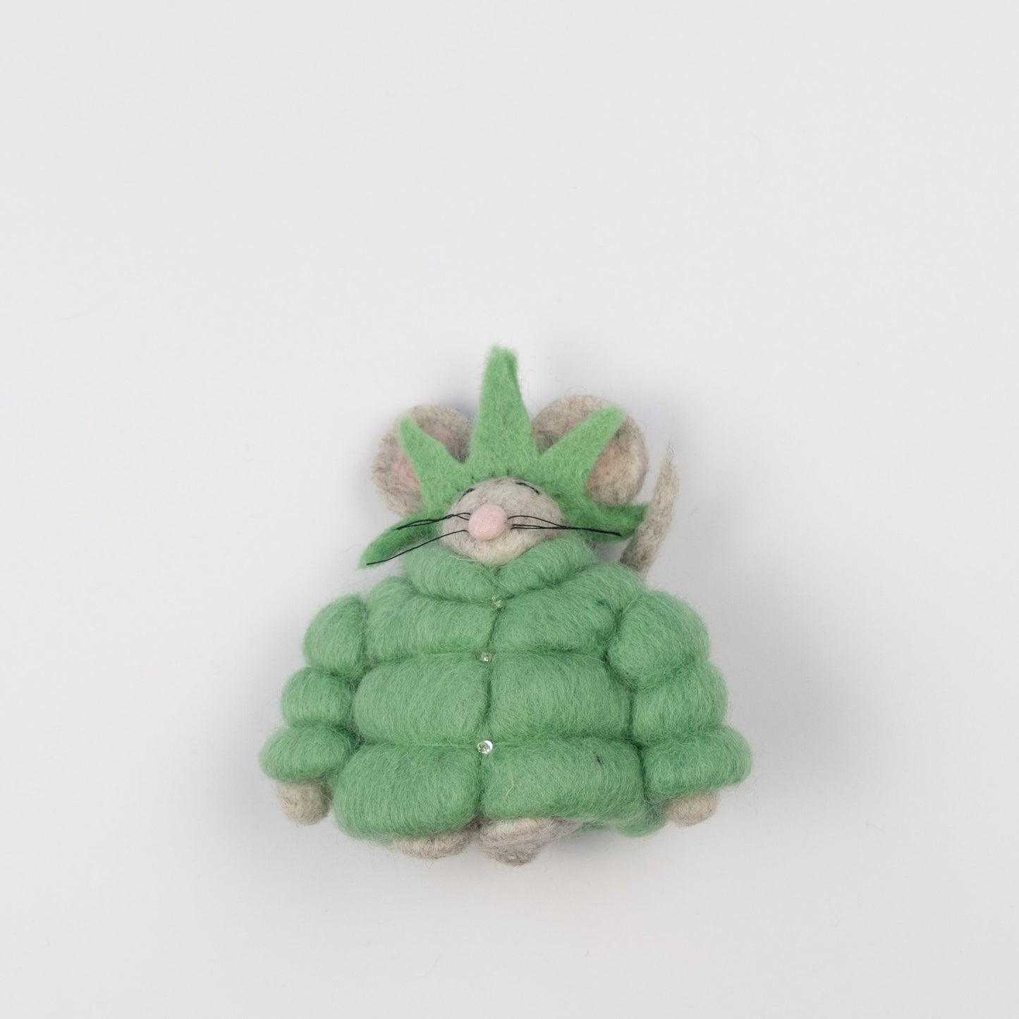 Felt ornament of a mouse in a green puffer jacket and statue of liberty crown.