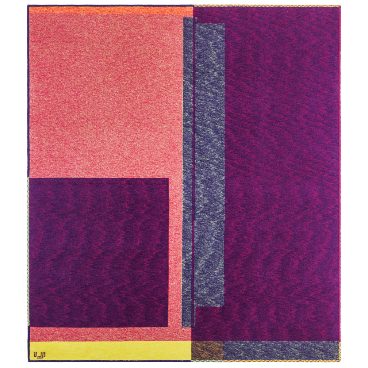 Blanket in bright purple, yellow, pink, and orange asymmetrical designs.