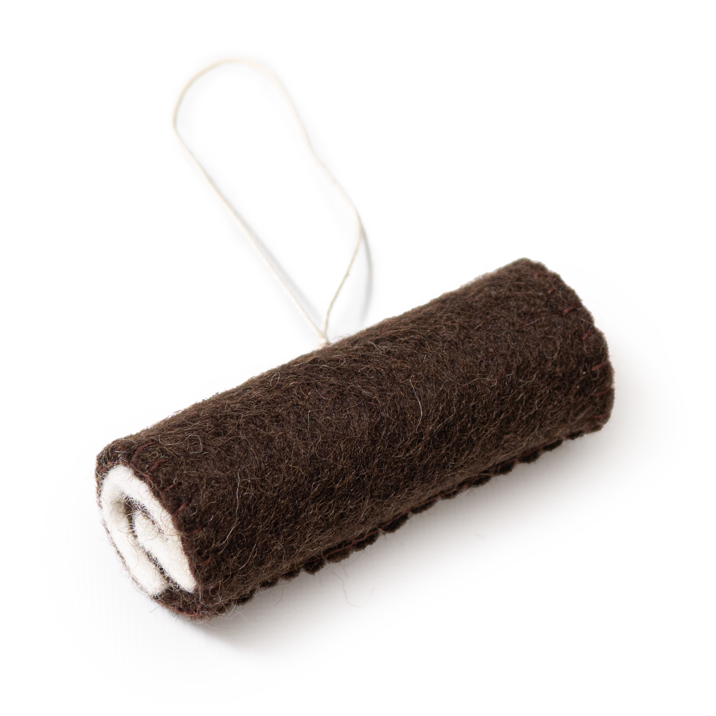 Felt ornament of a chocolate swiss roll cake.