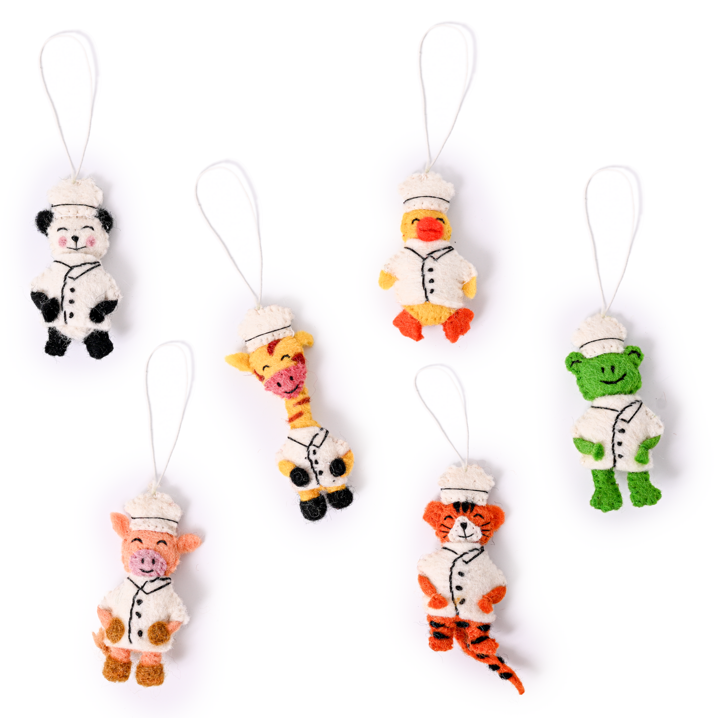Scattered felt ornaments of animals in Chef's hats and coats showing a panda, duck, giraffe, frog, pig, and tiger.