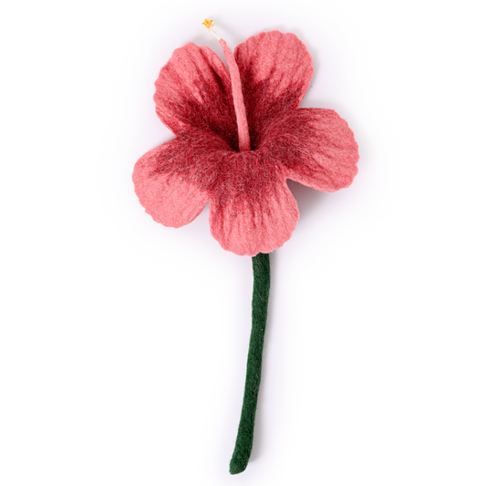 Coral pink colored felt hibiscus flower.
