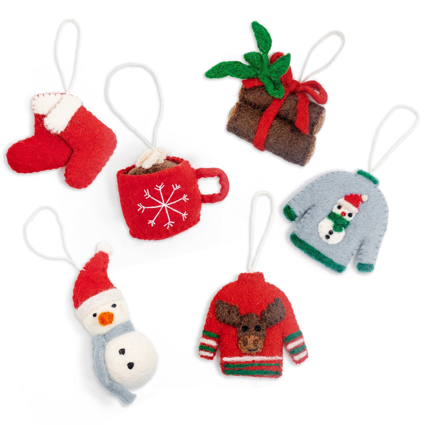 Felt ornaments of two red Christmas stockings, yule logs tied together with red bow, hot chocolate in red mug, grey sweater with snowman, snowman with red hat, and red sweater with a moose on it.