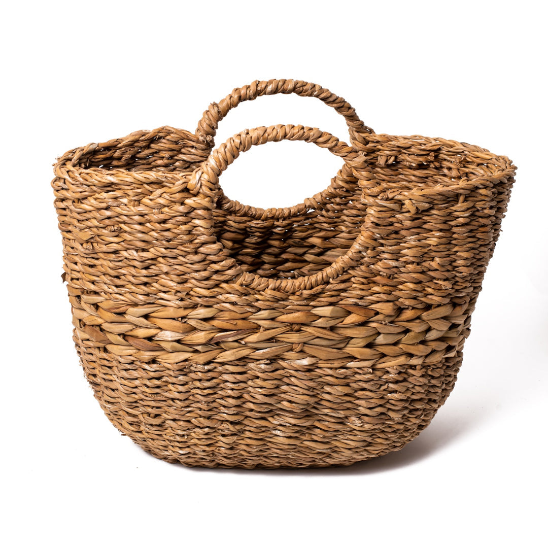 Brown woven basket with round handles.