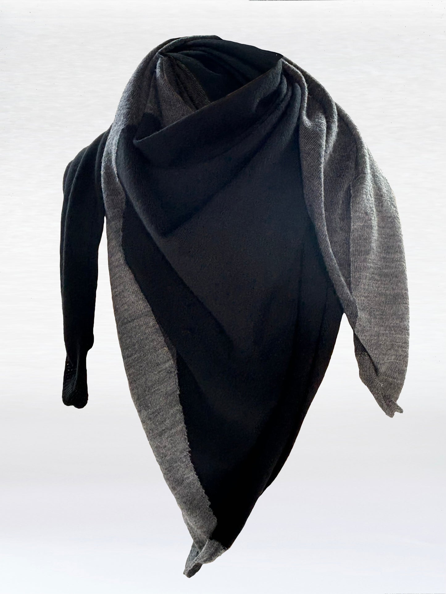 Scarf in black, charcoal, and light grey shaped as if wrapped around a mannikin.