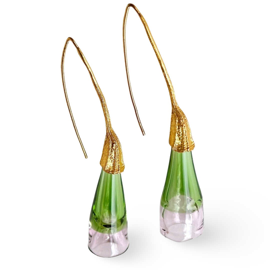 Pair of green and pale pink glass earrings with gold colored findings.