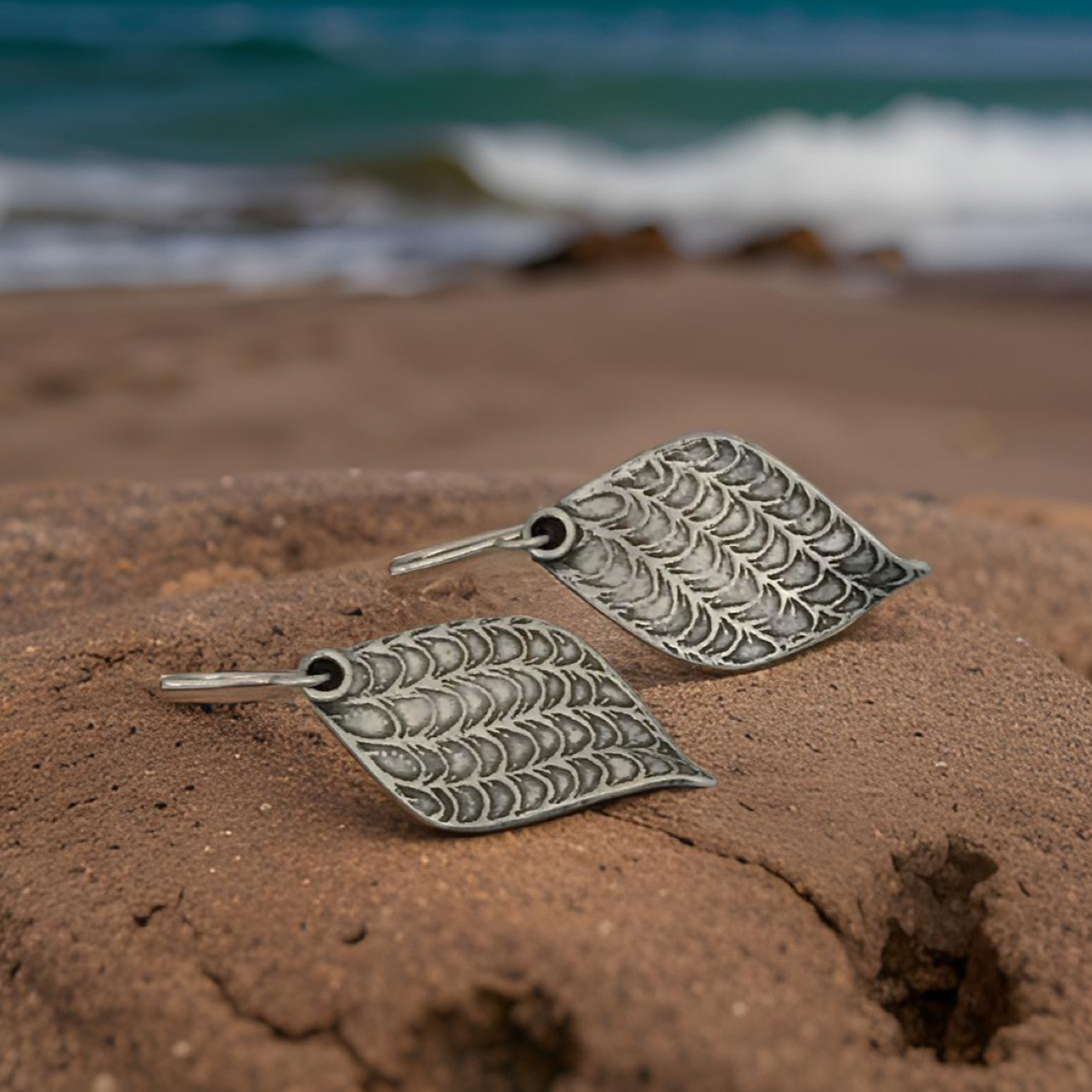 Pair of silver leaf earrings.