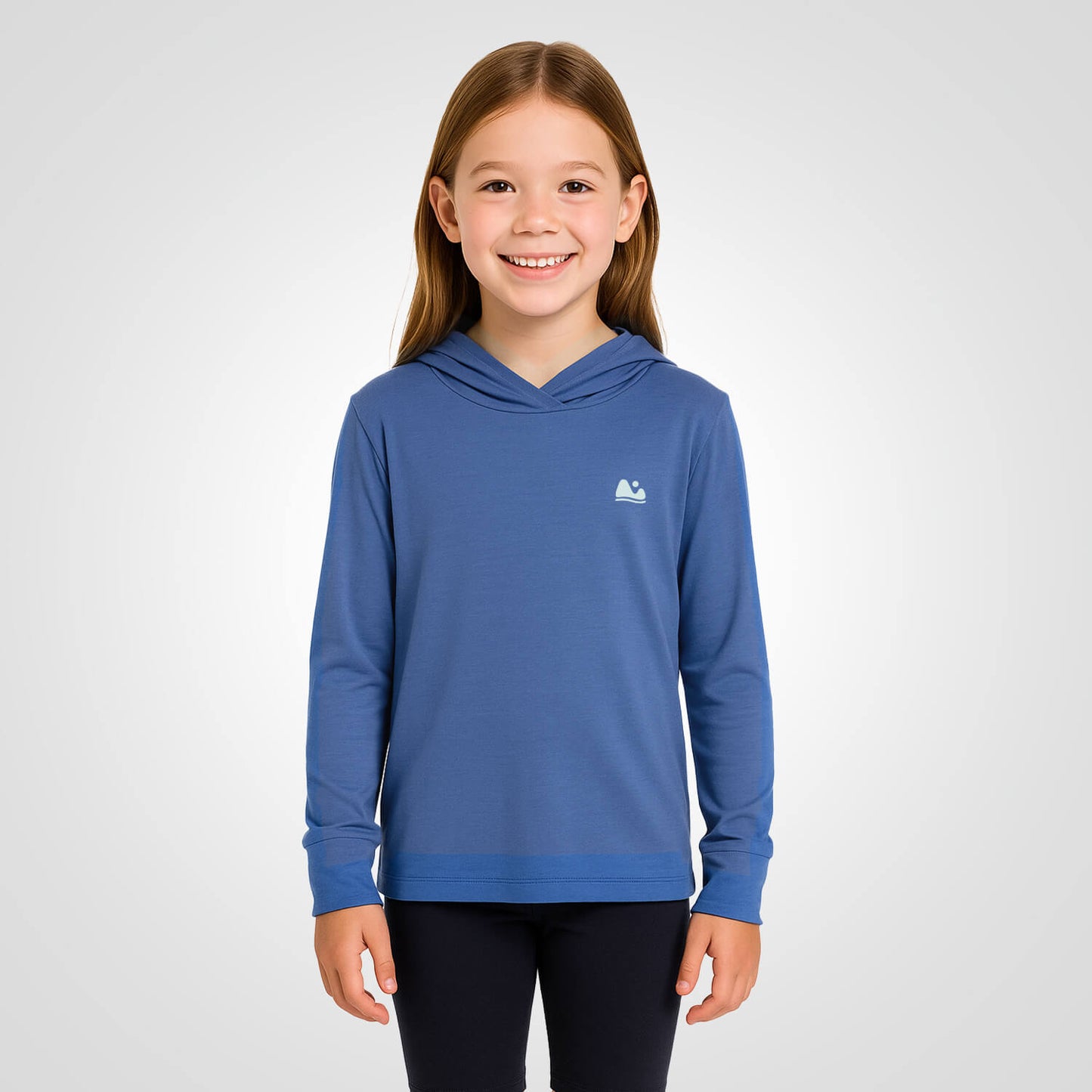 Girl wearing kids blue bamboo sun protecting upf sun shirt and base layer.
