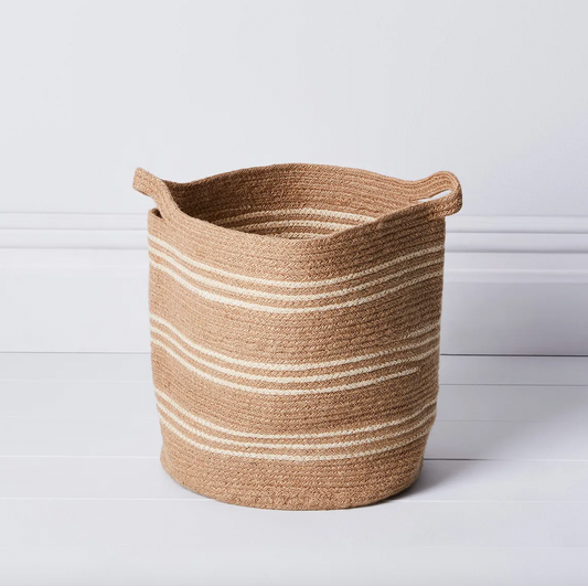 Brown and white striped jute basket.