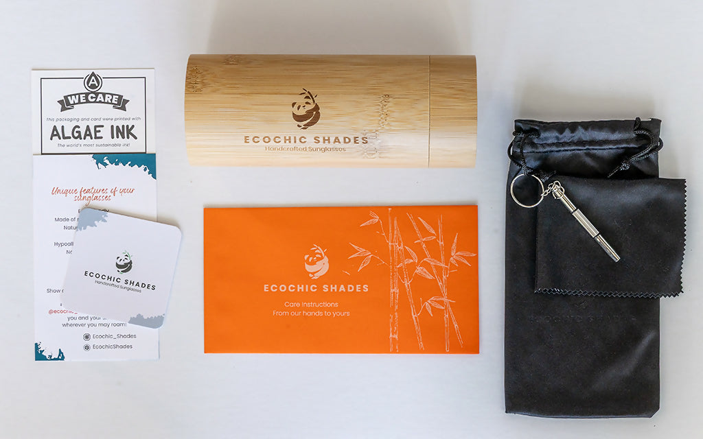 Cylindrical bamboo case, soft pouch, and Ecochic Shades care instructions on a countertop.