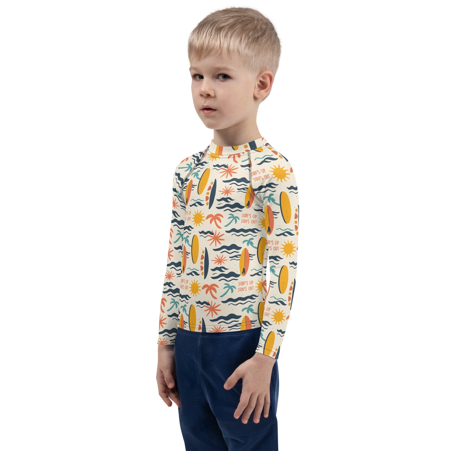 A surf-themed rash guard for youth with wave patterns, crafted for durability, sun protection, and outdoor fun.