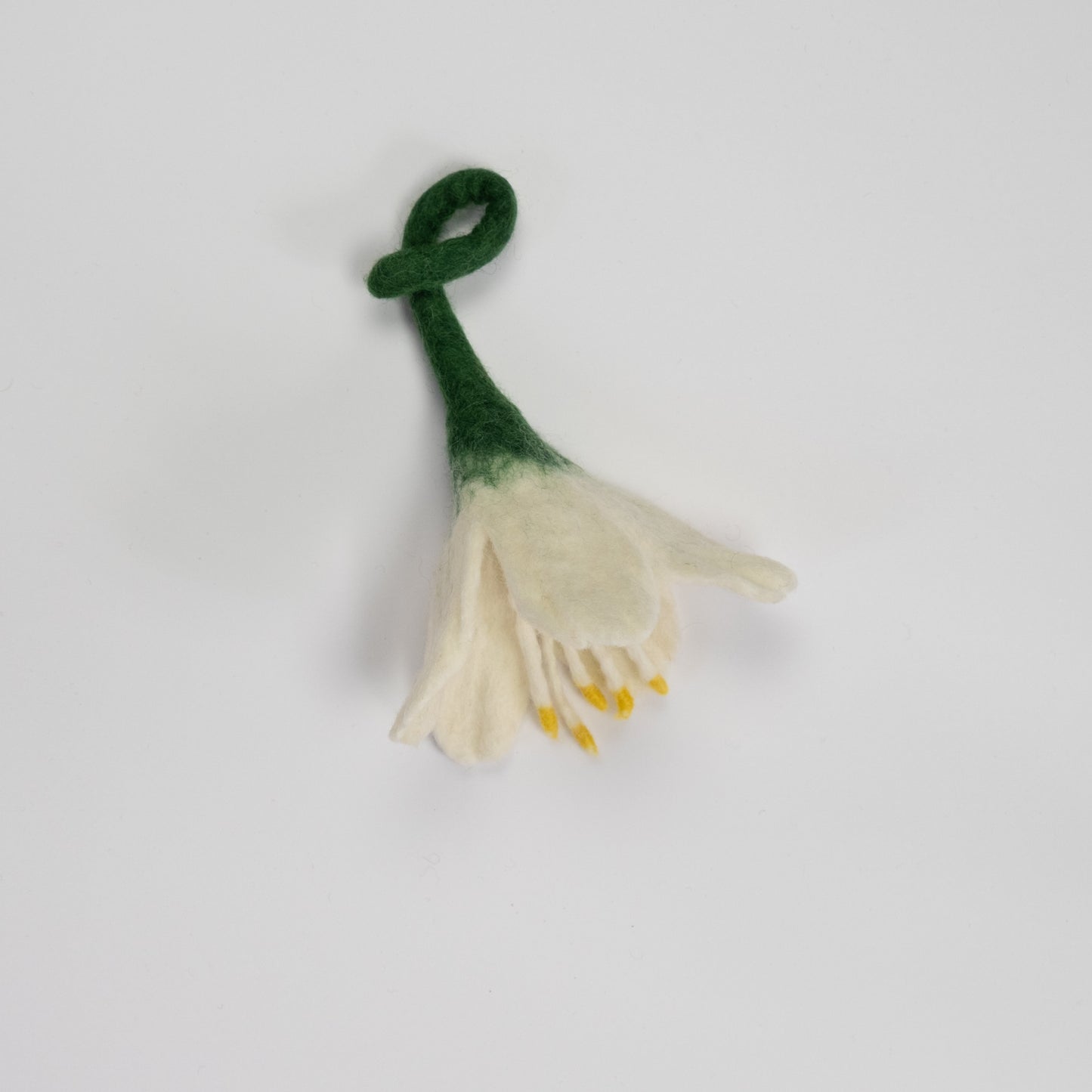 Felt ornament of a white flower.
