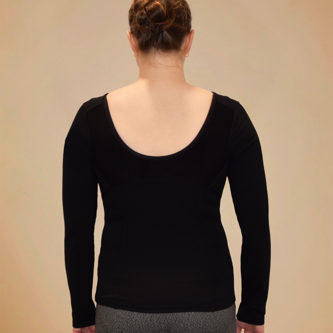 Back view of woman wearing black long sleeve shirt with scoop back.