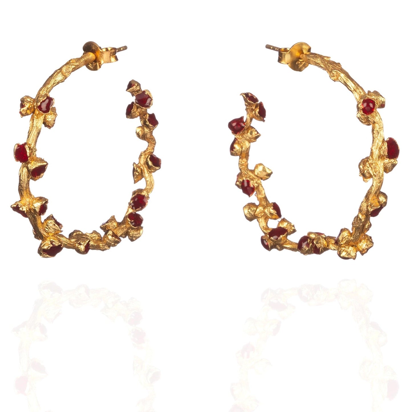 Pair of red and gold hoop earrings.