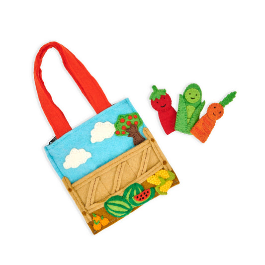 Farmer's market felt puppet bag with with three finger puppets, a tomato, a carrot, and a pea pod.