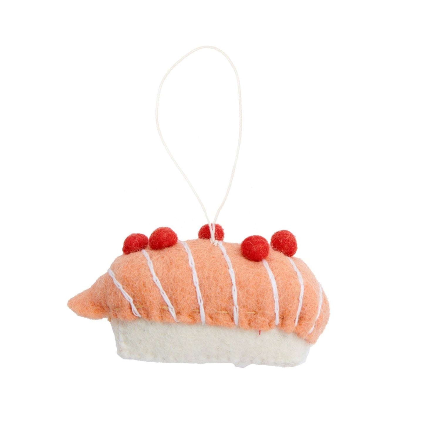 Felt ornament of salmon on rice sushi piece.