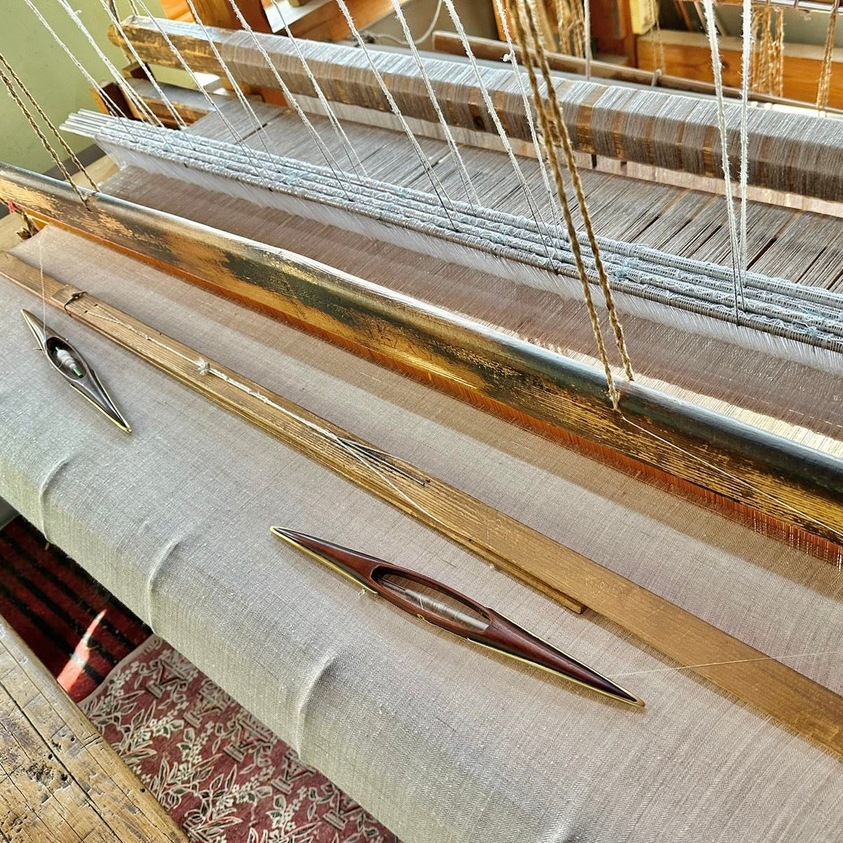 Weaving looms and material attached.