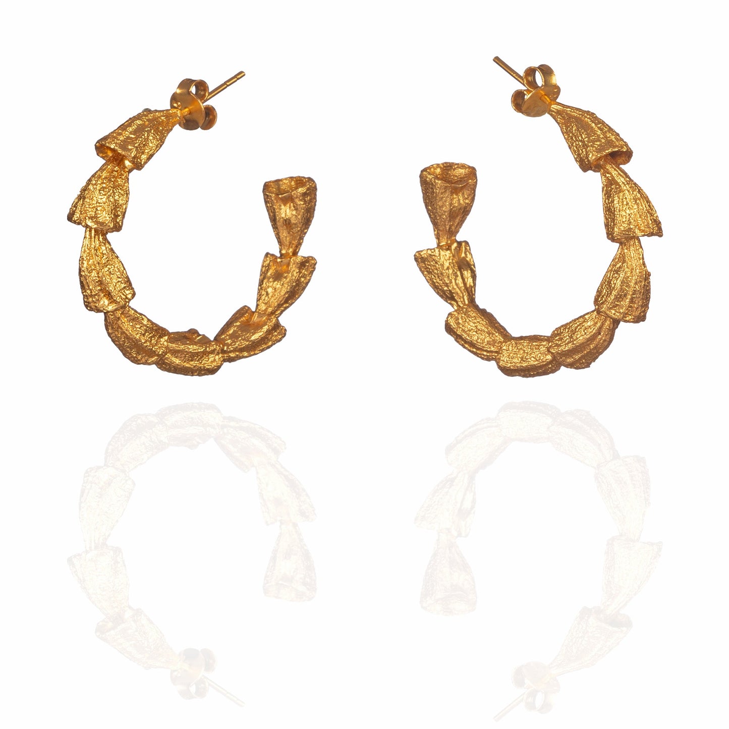 Pair of gold hoop earrings.