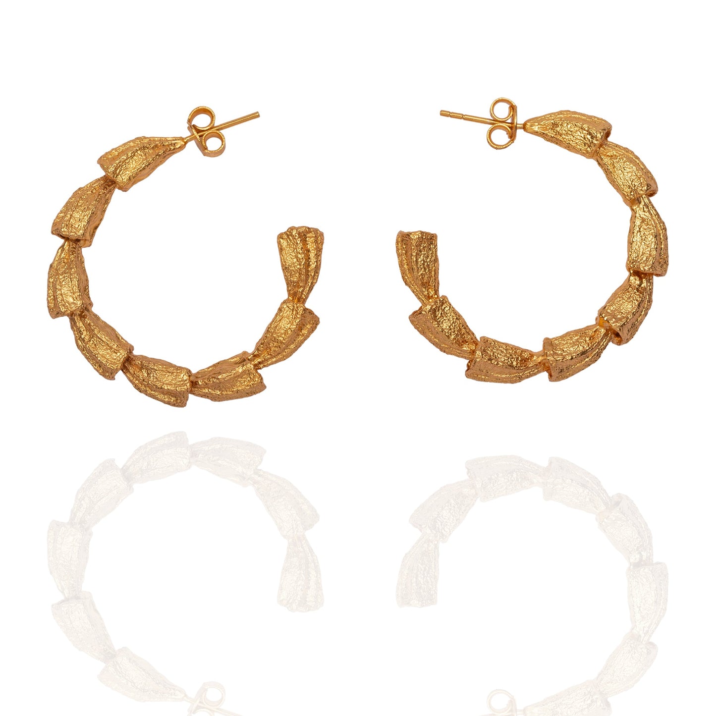 Pair of gold hoop earrings.