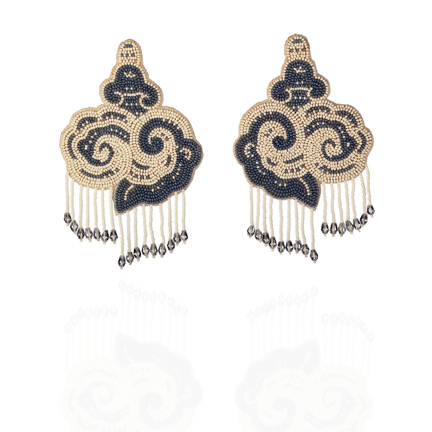 Pair of white and black cloud earrings with tassels.
