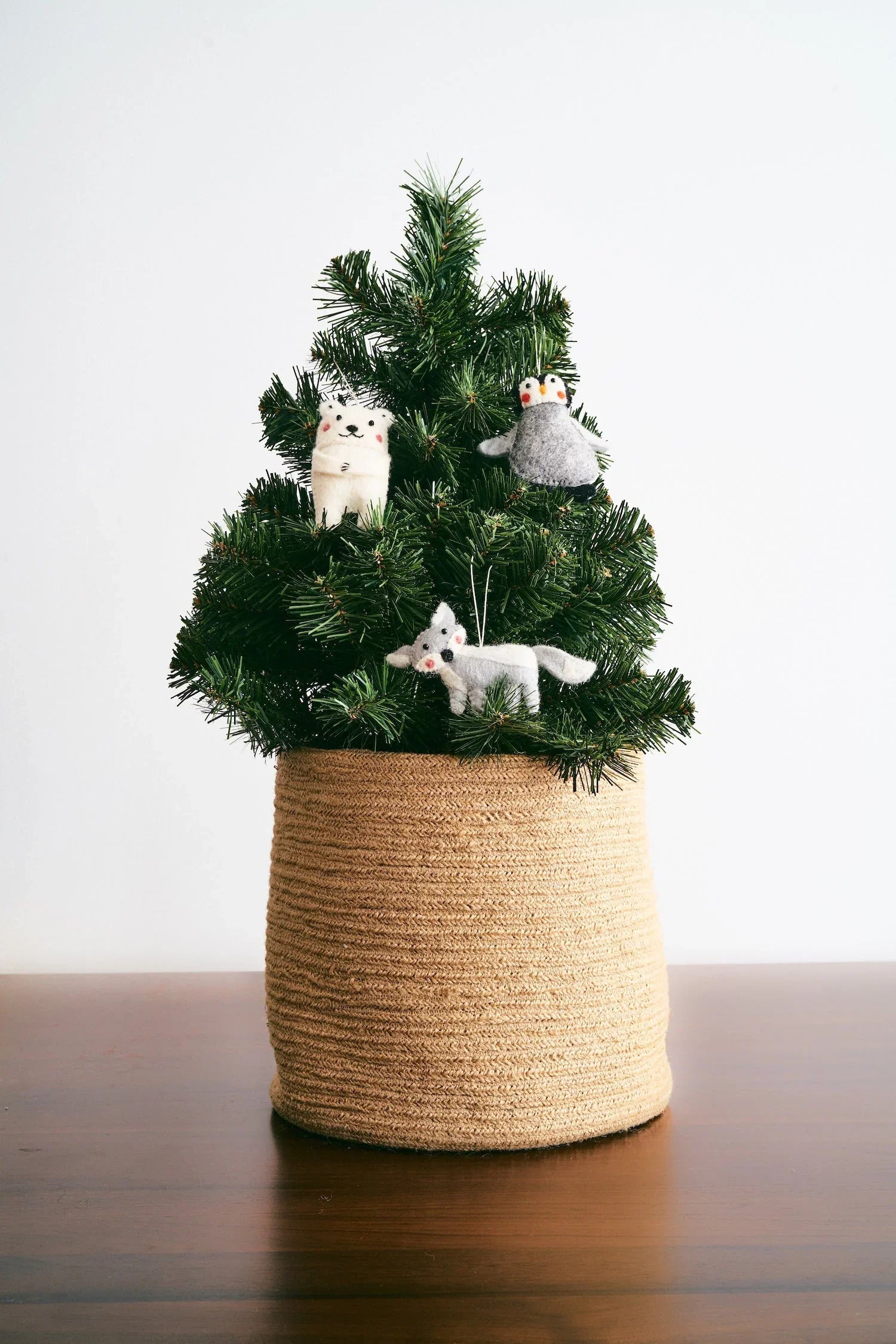 Mini Christmas tree with ornaments of felted wool arctic animals.