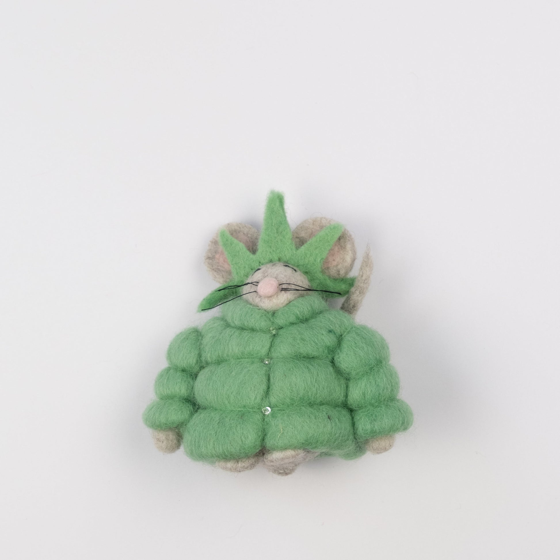 Felt ornament of a mouse in a green puffer jacket and statue of liberty crown.