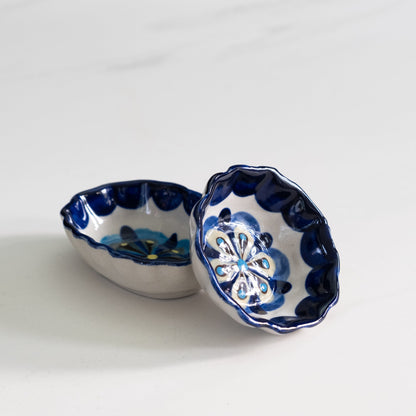 Blue and white painted round and oval tapas bowls.