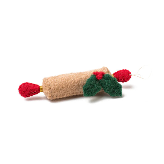 Felt ornament of a tan rolling pin with holly leaves and berries attached.
