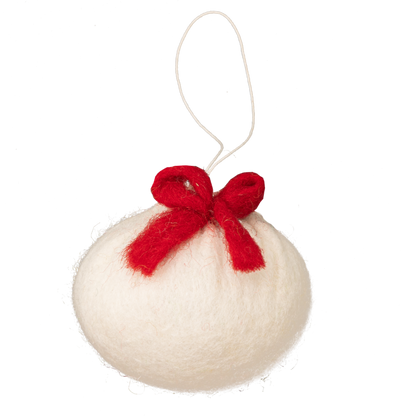 Felt ornament of a dumpling with a red bow on top.
