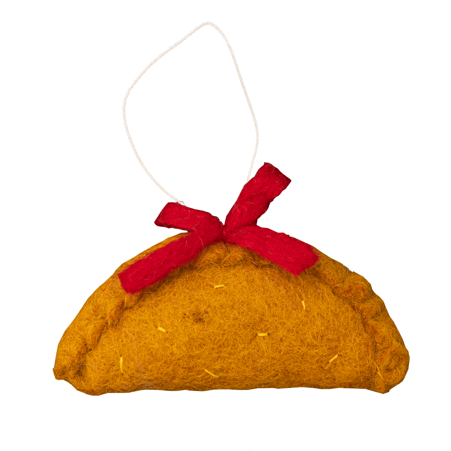 Felt ornament of an empanada with a red bow on top.