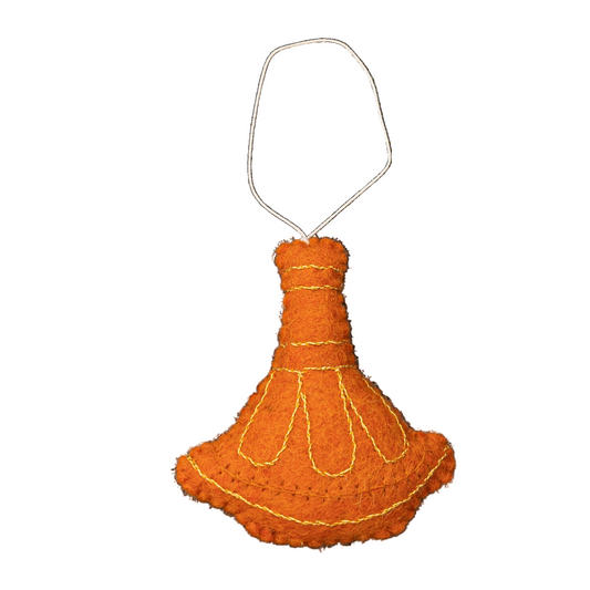 Felt ornament of an orange tagine pot with gold embroidery.