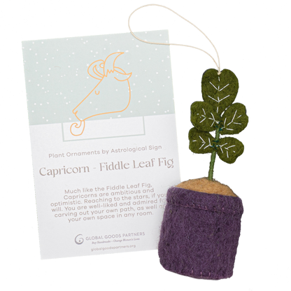 Felt ornament of a Fiddle Leaf plant with purple pot and card for Capricorn astrology.