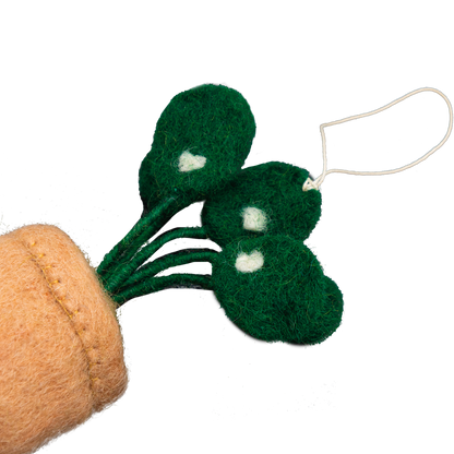Felt ornament of a Pilea plant in a brown pot.