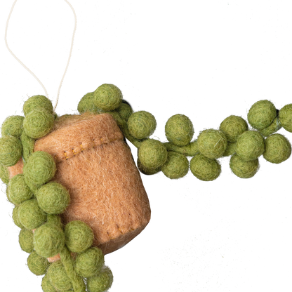 Felt ornament of a String of Pearls plant in a tan pot.