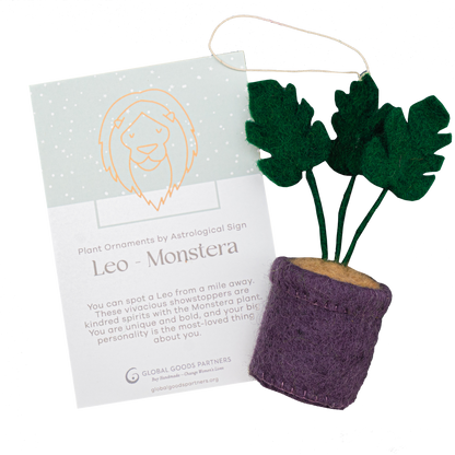 Felt ornament of a Monstera plant in a purple pot with a Leo astrology card.