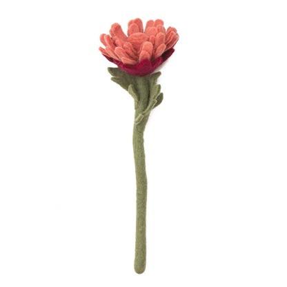 Dusty pink felt flower with many petals.