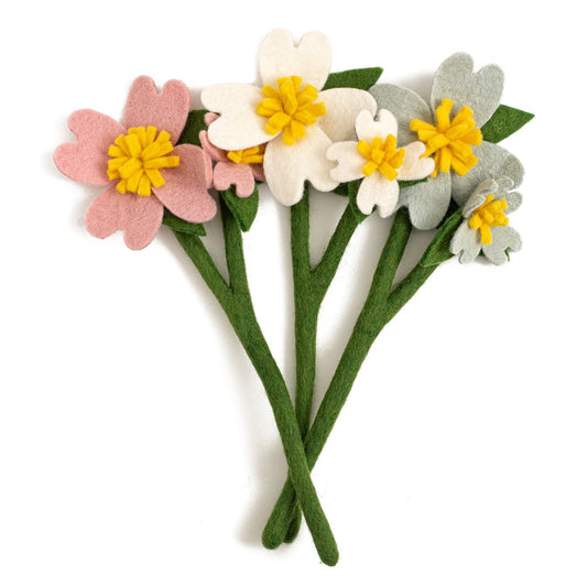 Bunch of felt Dogwood flowers in pink, white, and light grey.