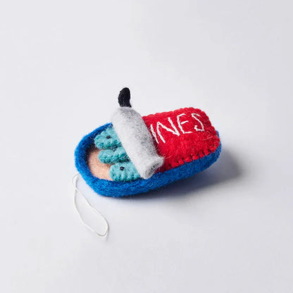 Side view of felt ornament of a can of sardines half open showing three fish.