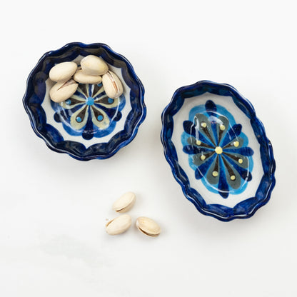 Blue and white painted round and oval tapas bowls.