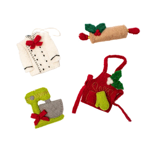 Felt ornaments of a chefs coat, a holiday rolling pin, a green mixer with red bow, and a red apron with green oven mit.