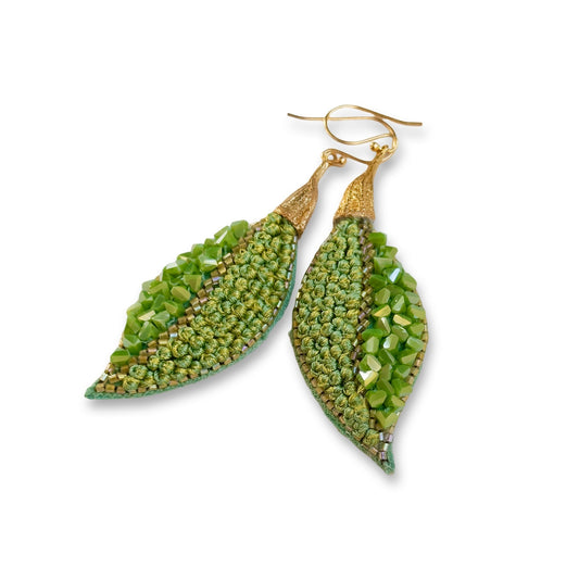 Pair of leaf shaped green glass bead earrings with gold findings.