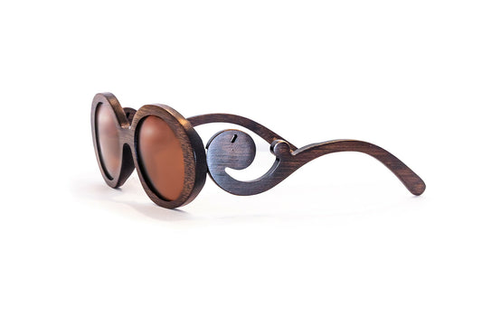 Brown bamboo sunglasses with brown lenses with scroll like design on arms.