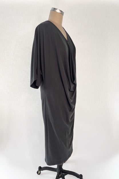 Right front view of Knitted Orbis dress in iron color on mannikin.