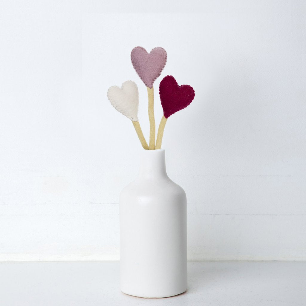 Felt heart accent stems in white, pink, and red to add to felt bouquet in white vase.