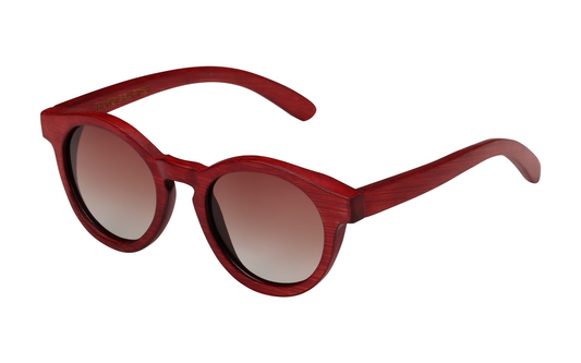 Diagonal view of red natural bamboo sunglasses with gradient circular tinted lenses.