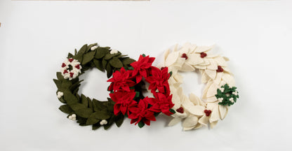 Felt ornaments of mini wreaths in green, red, and white.