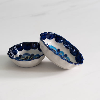 Blue and white painted round and oval tapas bowls.