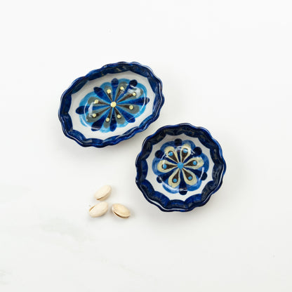 Blue and white painted round and oval tapas bowls.