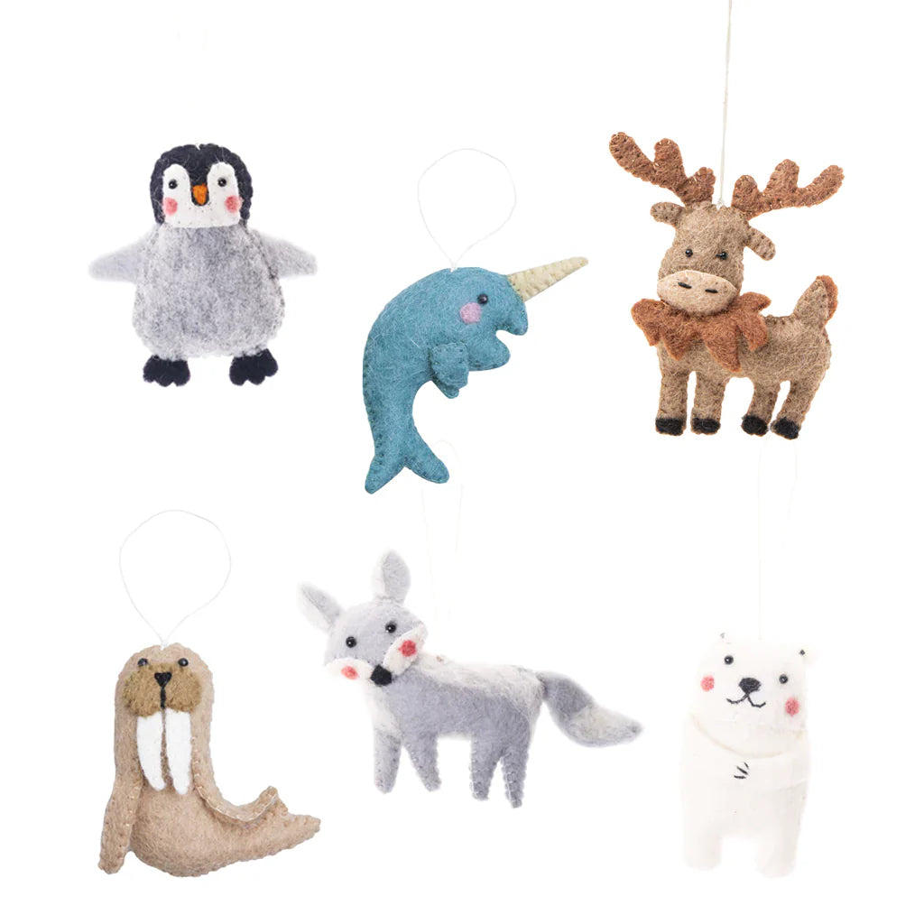 Felted wool ornaments of a narwal, walrus, fox, moose, penguin, and polar bear.