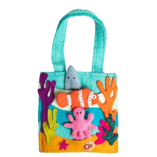 Felt bag with under the sea finger puppets of an orange and white clown fish, a pink octopus, and a grey shark.