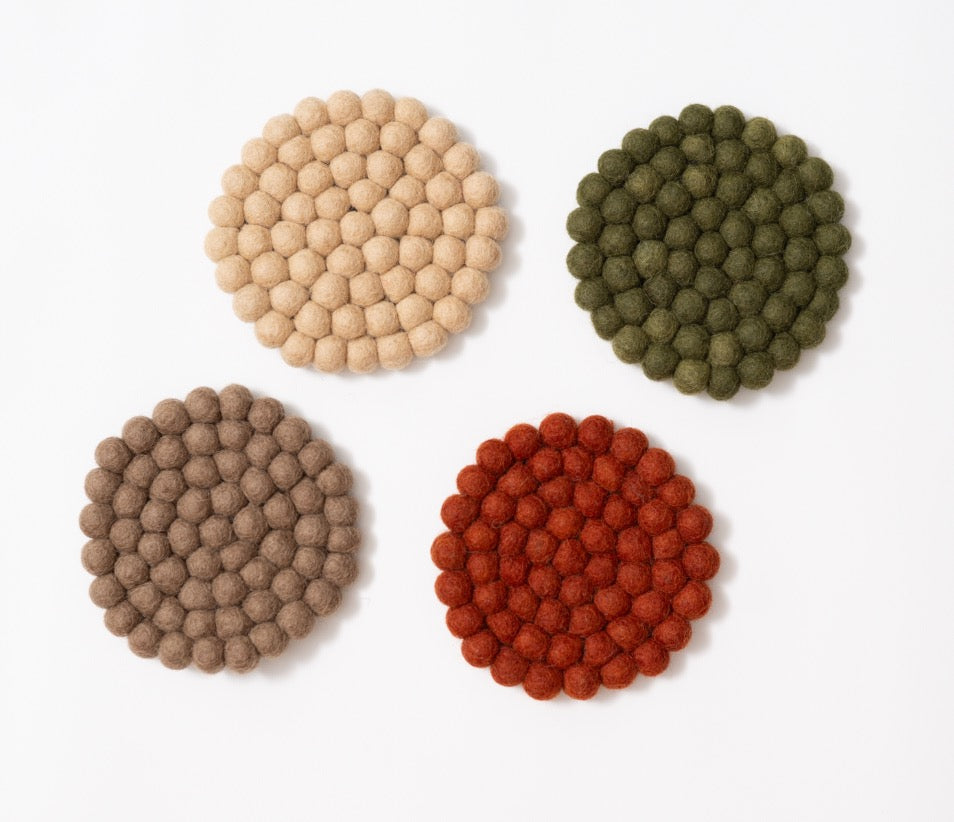 Felt circle coasters in red, green, brown, yellow.
